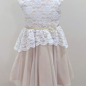 A white and tan ish color lace dress, very nice condition.